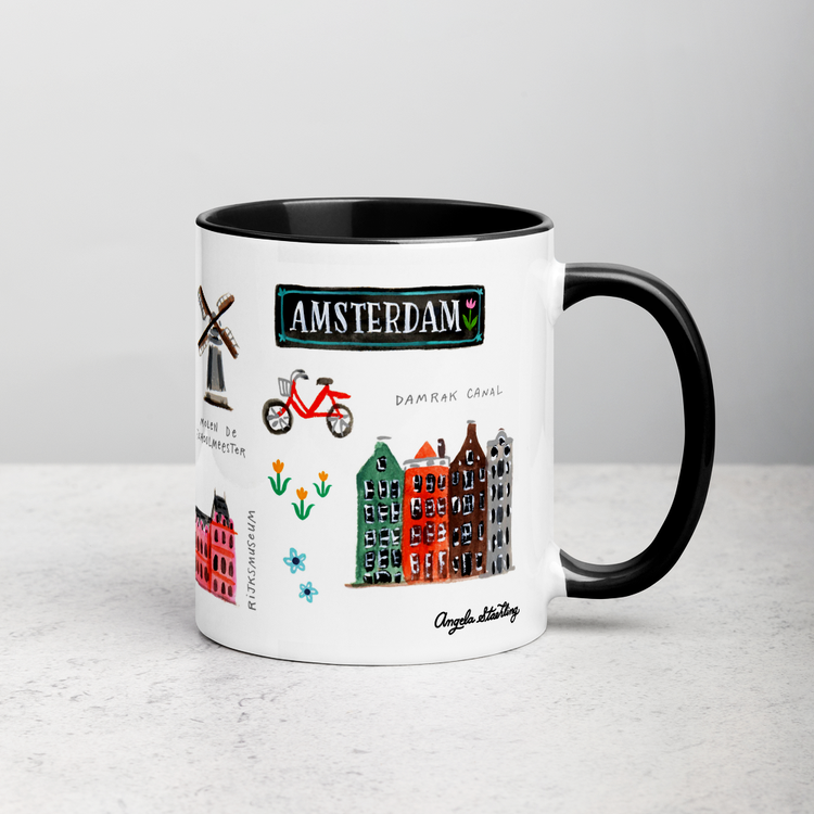 White ceramic coffee mug with black handle and inside; has Amsterdam illustration by Angela Staehling