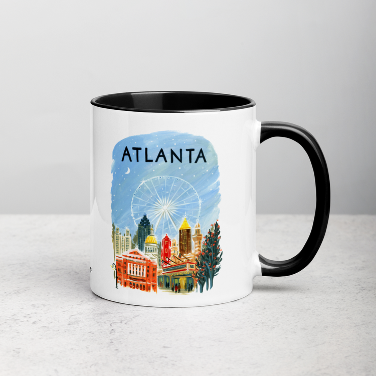 White ceramic coffee mug with black handle and inside; has Atlanta illustration by Angela Staehling