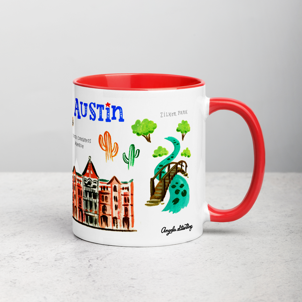 White ceramic coffee mug with red handle and inside; has Austin landmarks illustration by Angela Staehling