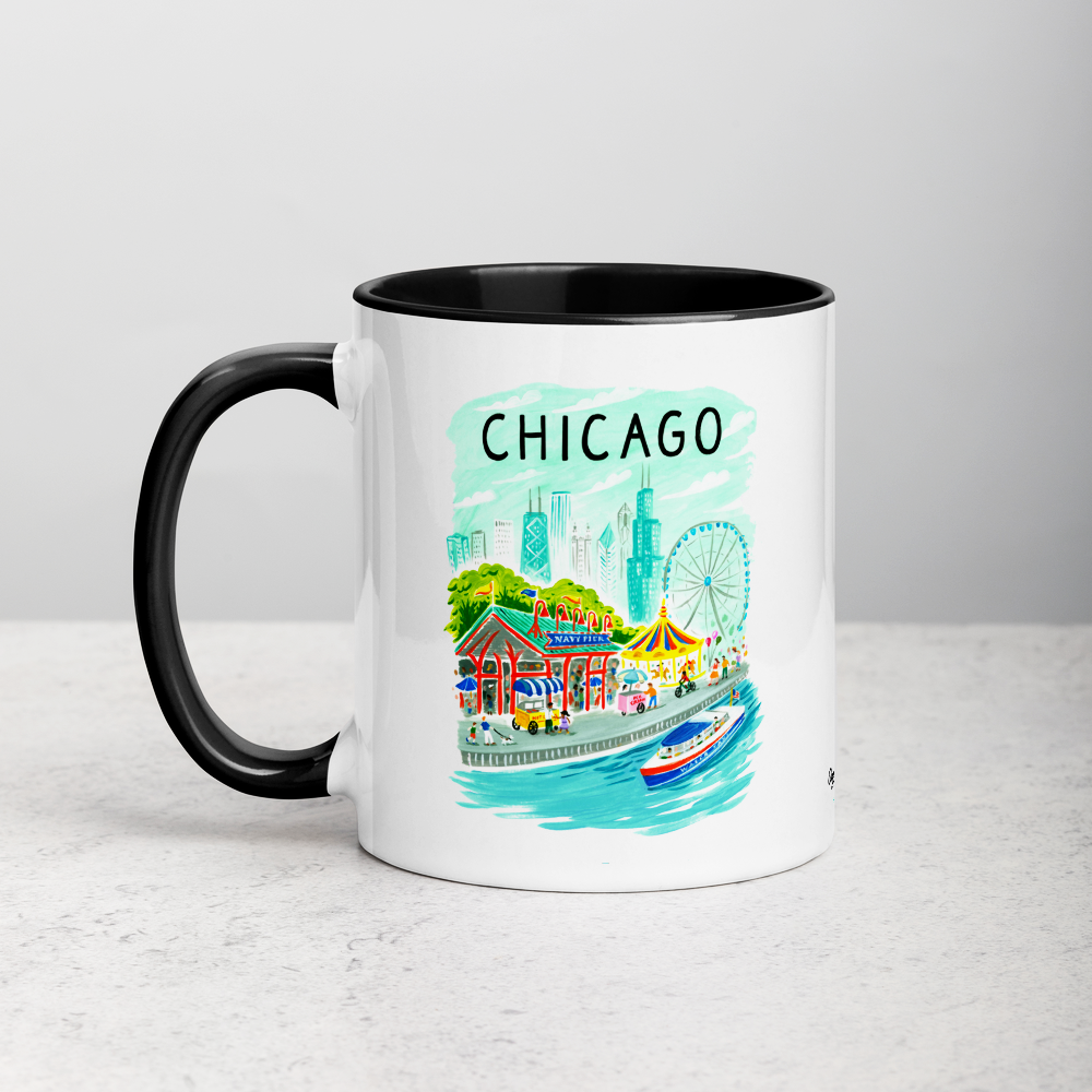 White ceramic coffee mug with black handle and inside; has Chicago Navy Pier illustration by Angela Staehling