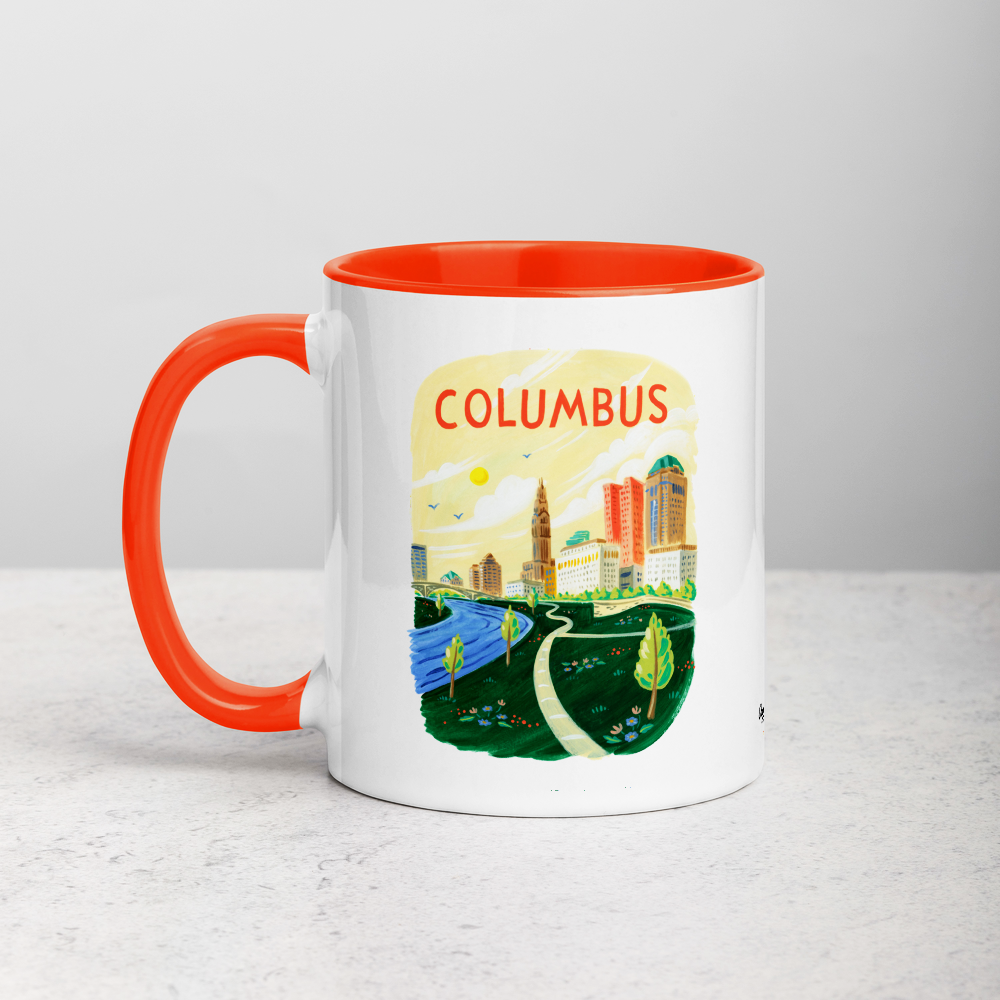 White ceramic coffee mug with orange handle and inside; has Columbus Ohio illustration by Angela Staehling