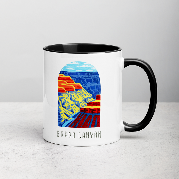 White ceramic coffee mug with black handle and inside; has Grand Canyon National Park illustration by Angela Staehling