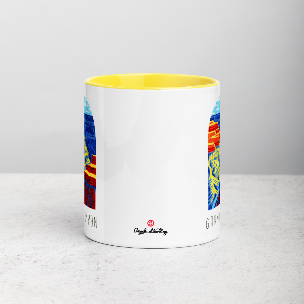White ceramic coffee mug with yellow handle and inside; has Grand Canyon National Park illustration by Angela Staehling
