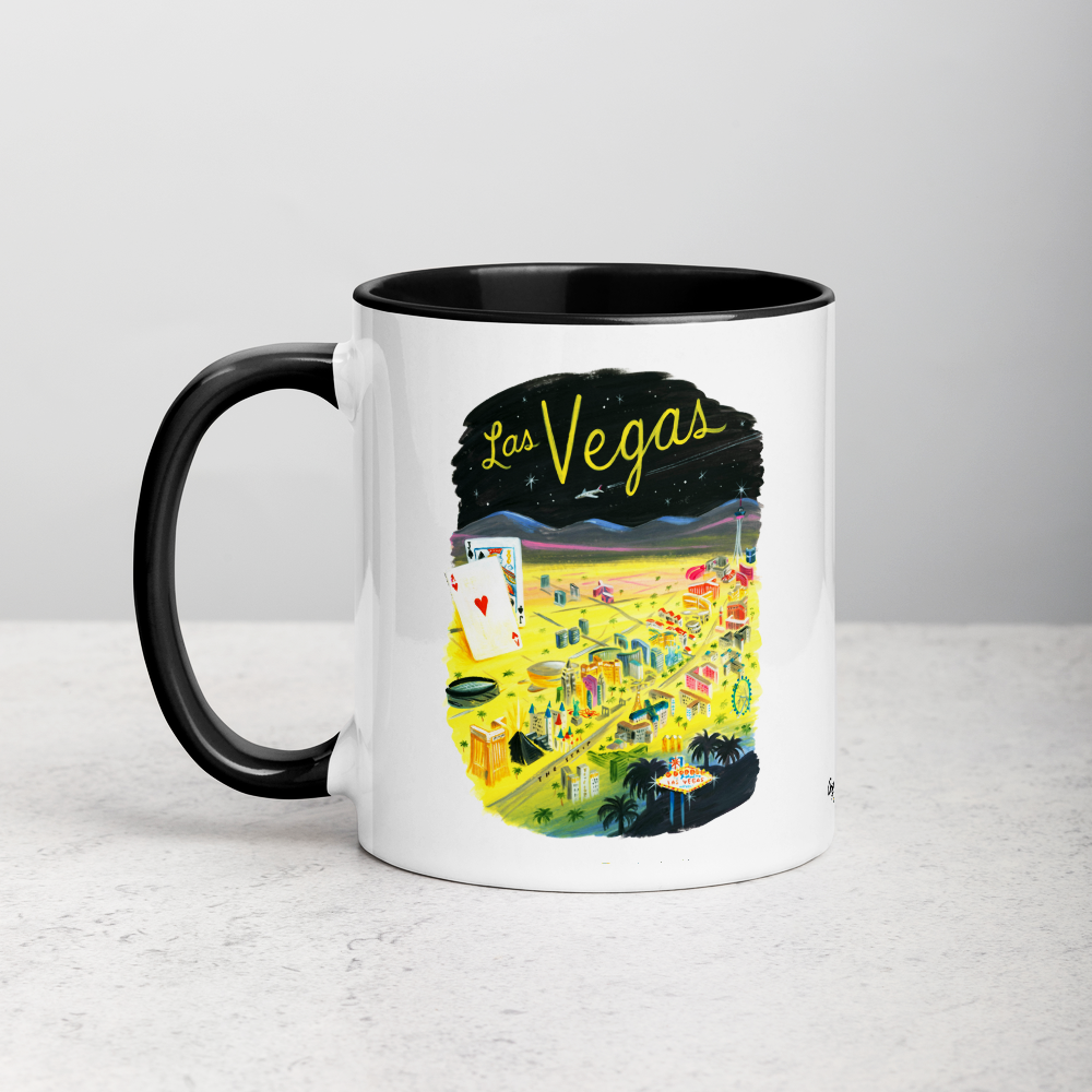 White ceramic coffee mug with black handle and inside; has Las Vegas illustration by Angela Staehling
