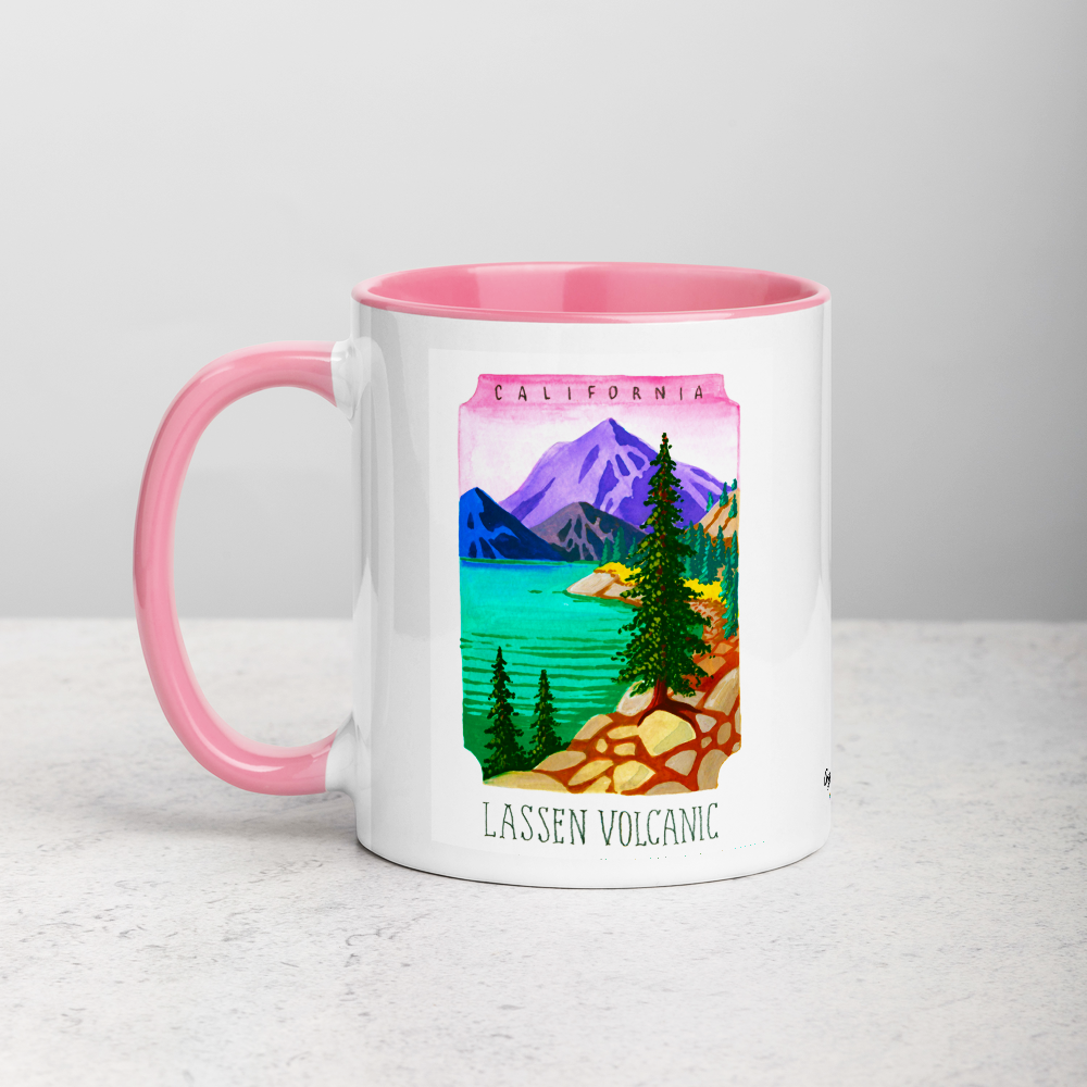 White ceramic coffee mug with pink handle and inside; has Lassen Volcanic National Park illustration by Angela Staehling