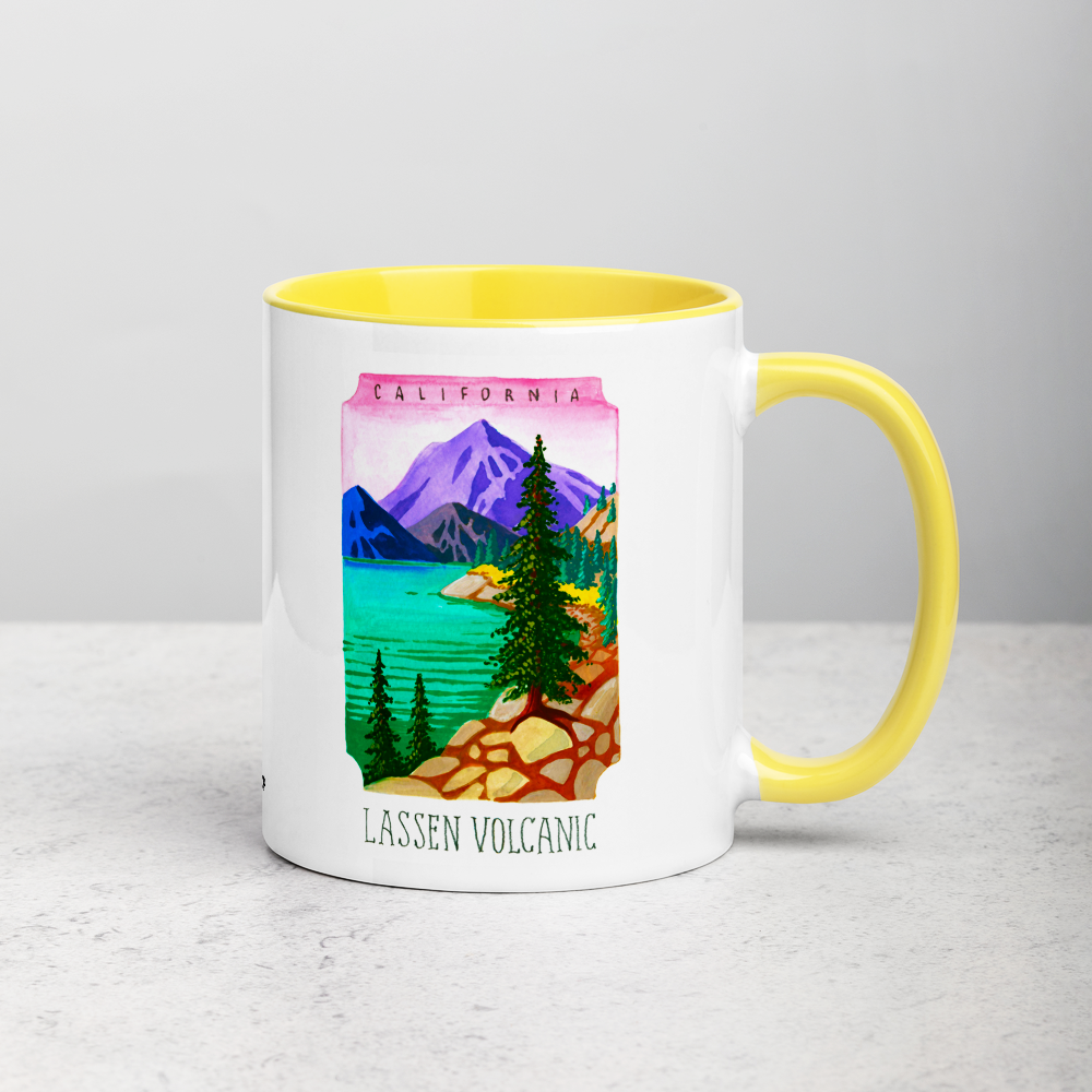 White ceramic coffee mug with yellow handle and inside; has Lassen Volcanic National Park illustration by Angela Staehling