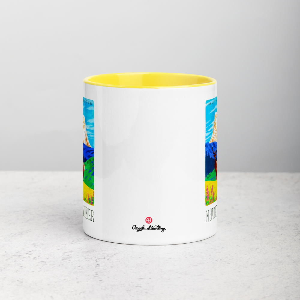 White ceramic coffee mug with yellow handle and inside; has Mount Rainier National Park illustration by Angela StaehlingWhite ceramic coffee mug with yellow handle and inside; has Mount Rainier National Park illustration by Angela Staehling