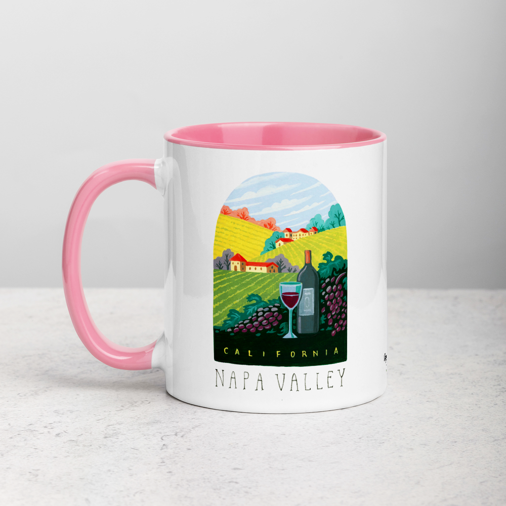 White ceramic coffee mug with pink handle and inside; has Napa Valley California illustration by Angela Staehling