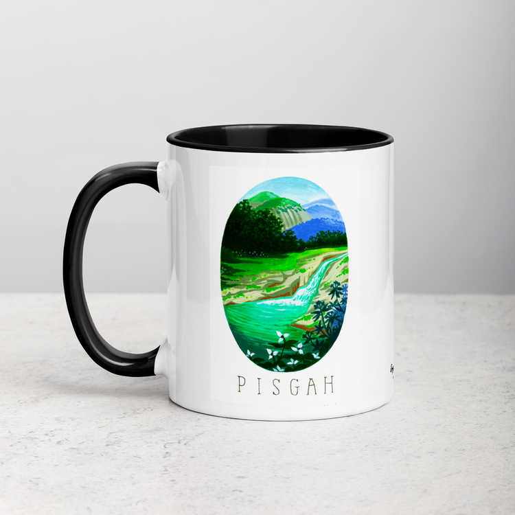 White ceramic coffee mug with black handle and inside; has Pisgah National Park illustration by Angela Staehling