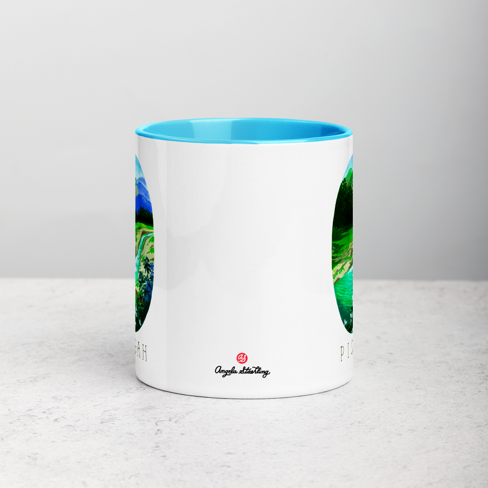White ceramic coffee mug with blue handle and inside; has Pisgah National Park illustration by Angela Staehling
