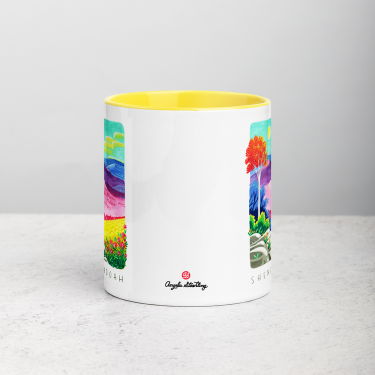 White ceramic coffee mug with yellow handle and inside; has Shenandoah National Park illustration by Angela Staehling