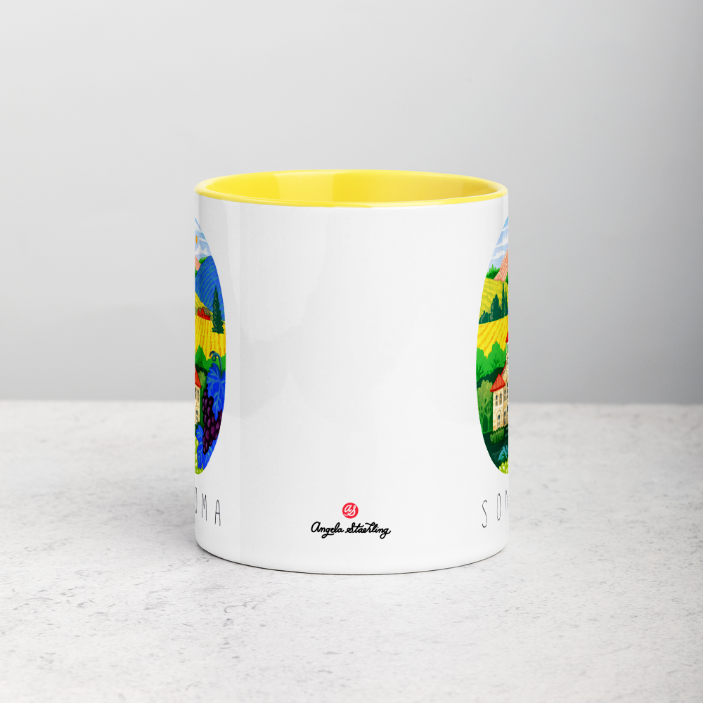 White ceramic coffee mug with yellow handle and inside; has Sonoma Valley California illustration by Angela Staehling