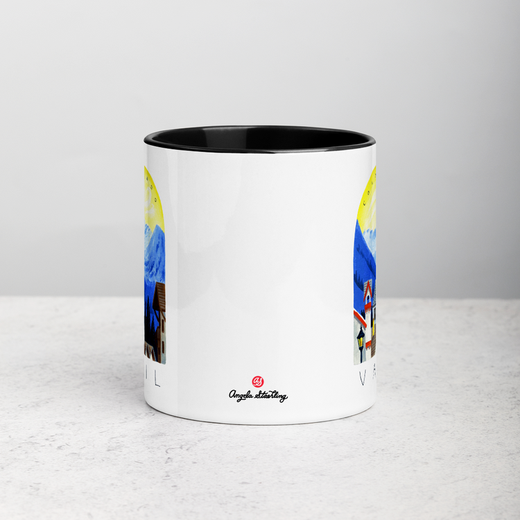 White ceramic coffee mug with black handle and inside; has Sonoma Vail Colorado illustration by Angela Staehling