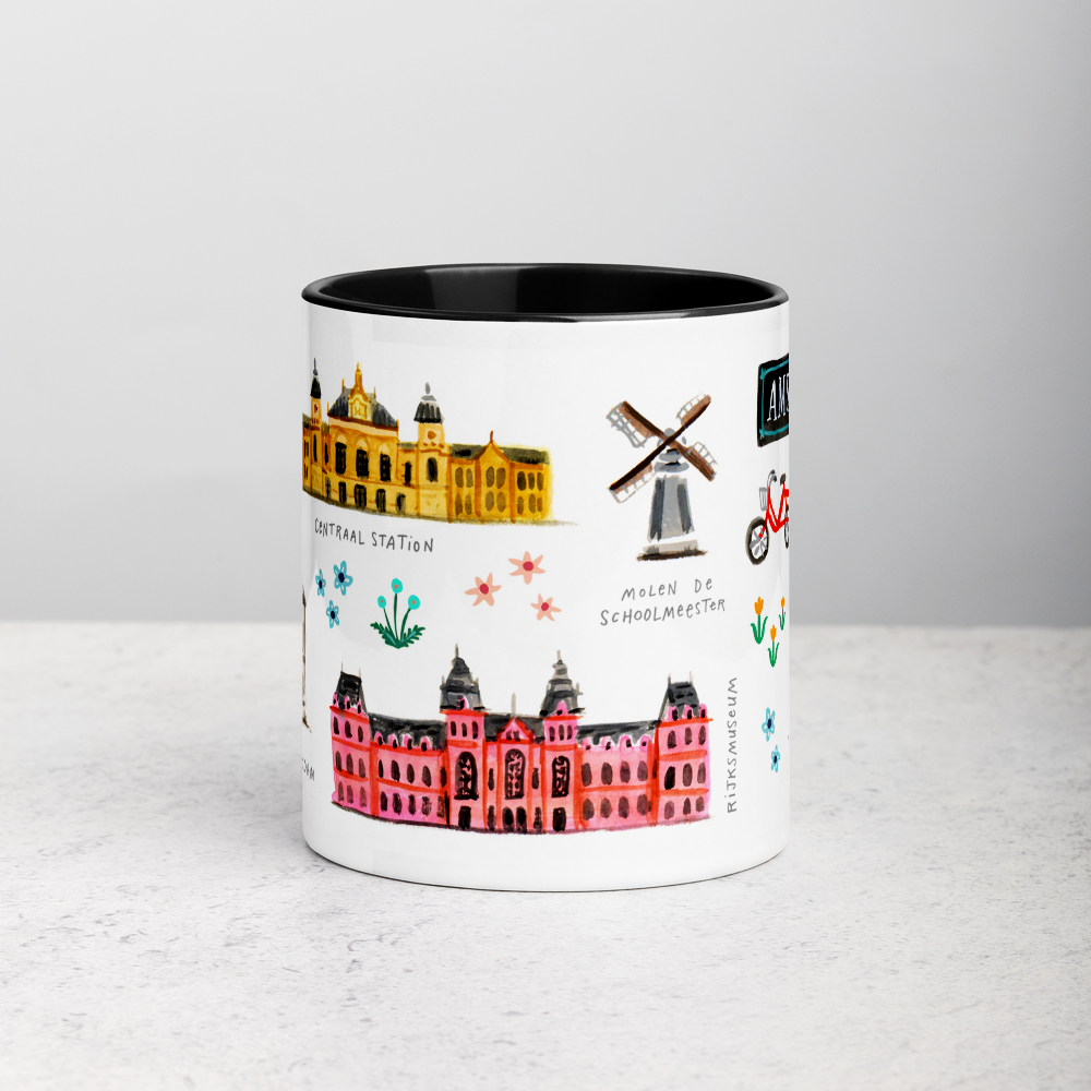 White ceramic coffee mug with black handle and inside; has Amsterdam illustration by Angela Staehling