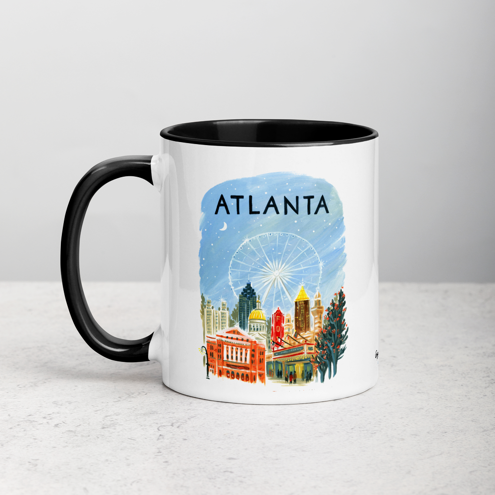 White ceramic coffee mug with black handle and inside; has Atlanta illustration by Angela Staehling