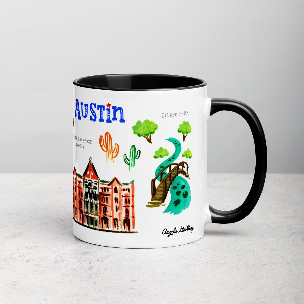 White ceramic coffee mug with black handle and inside; has Austin landmarks illustration by Angela Staehling