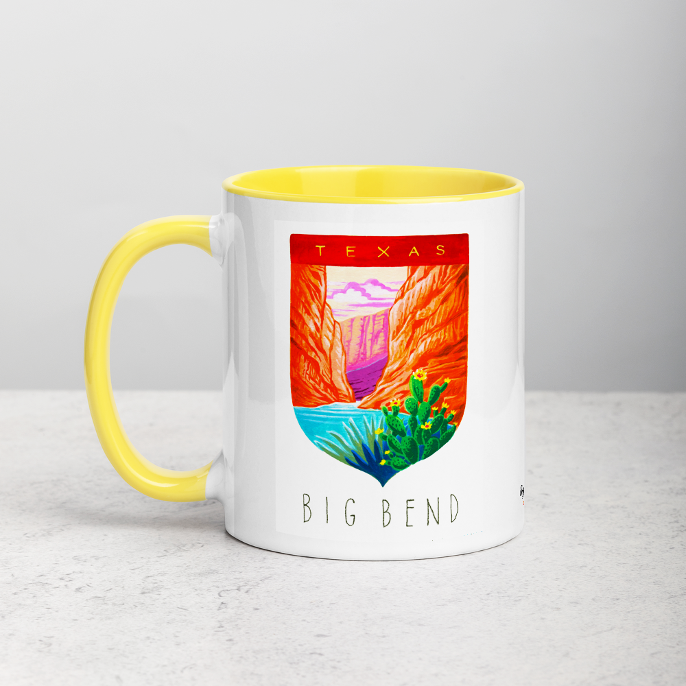 White ceramic coffee mug with yellow handle and inside; has Big Bend National Park illustration by Angela Staehling
