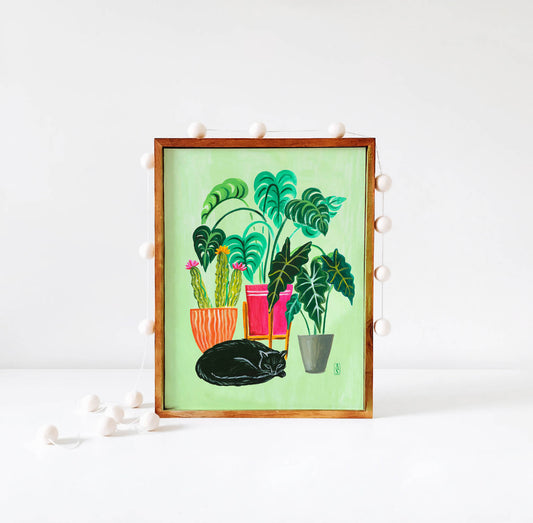 Black cat and houseplants illustration in wood frame