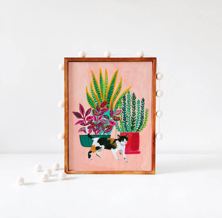 Calico cat and houseplant illustration in wood frame