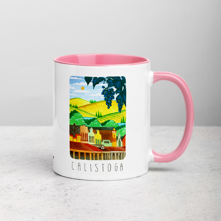 White ceramic coffee mug with pink handle and inside; has Calistoga California illustration by Angela Staehling