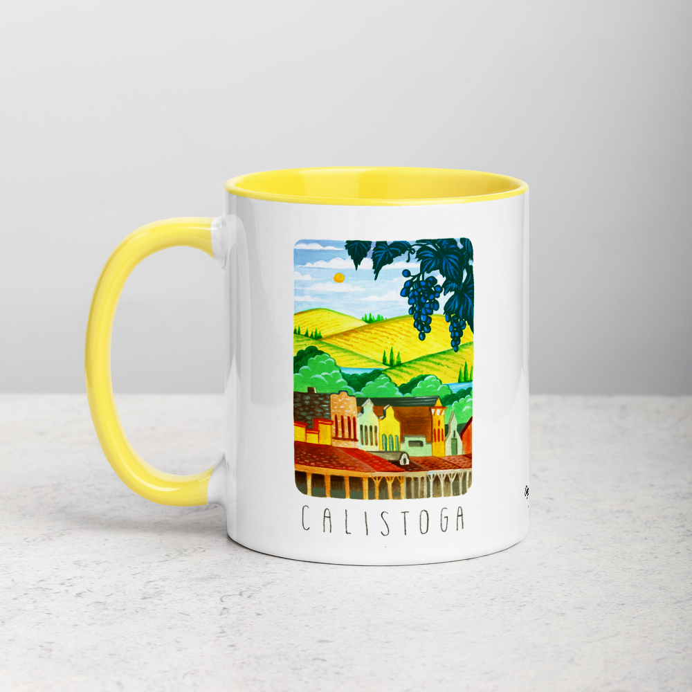 White ceramic coffee mug with yellow handle and inside; has Calistoga California illustration by Angela Staehling