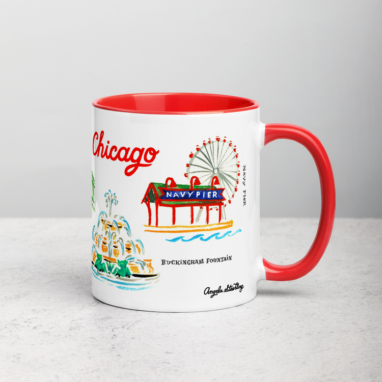 White ceramic coffee mug with red handle and inside; has Chicago landmarks illustration by Angela Staehling