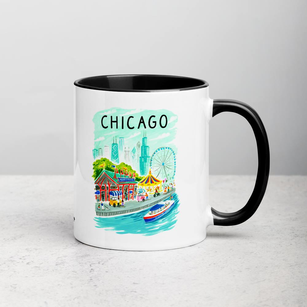 White ceramic coffee mug with black handle and inside; has Chicago Navy Pier illustration by Angela Staehling