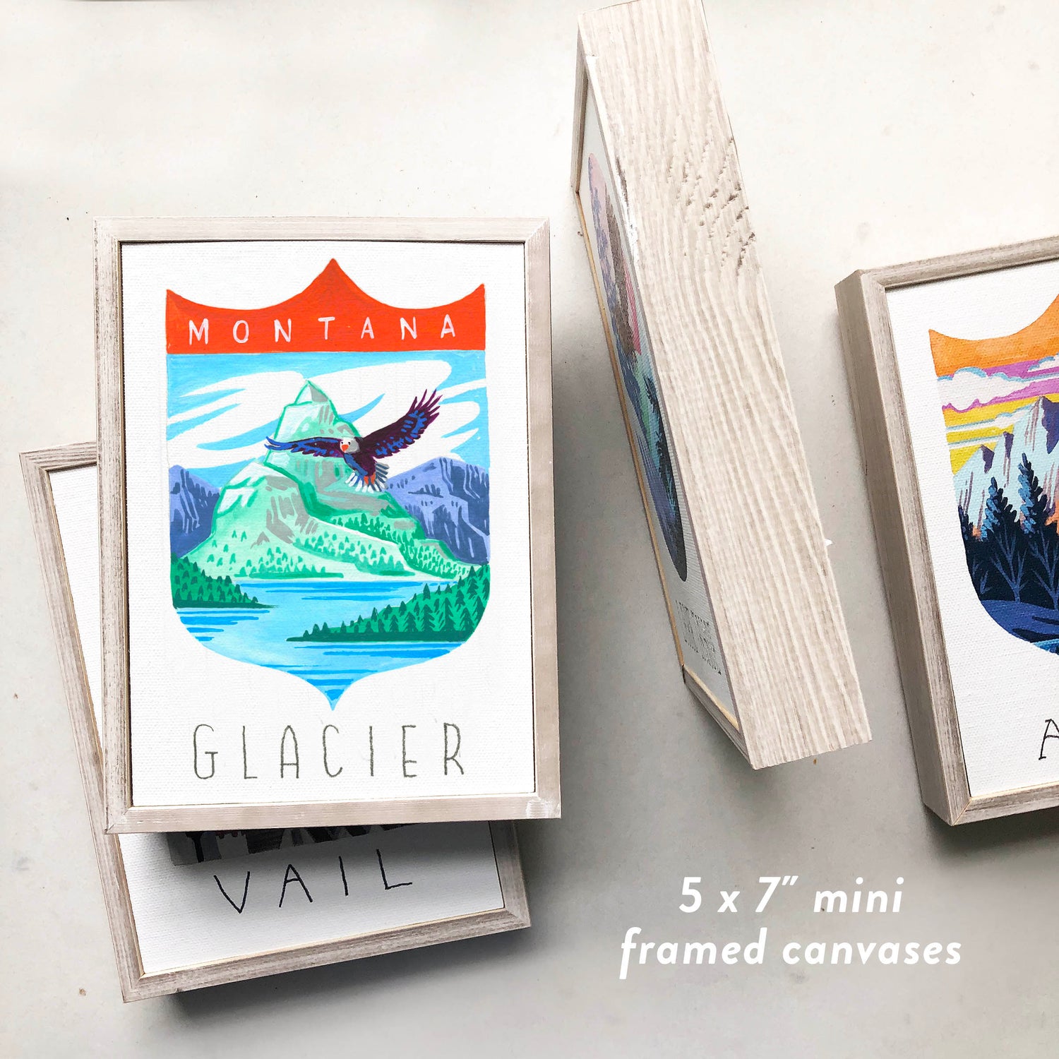 Glacier National Park framed art with bald eagle, Rocky Mountains, and Hidden Lake; trendy illustration by Angela Staehling