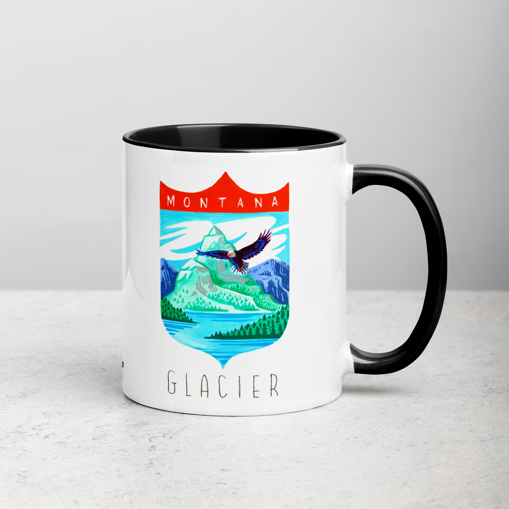 White ceramic coffee mug with black handle and inside; has Glacier National Park illustration by Angela Staehling