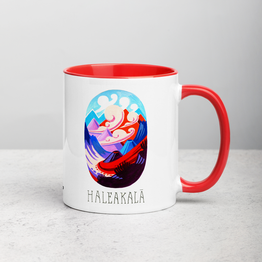 White ceramic coffee mug with red handle and inside; has Haleakala National Park illustration by Angela Staehling