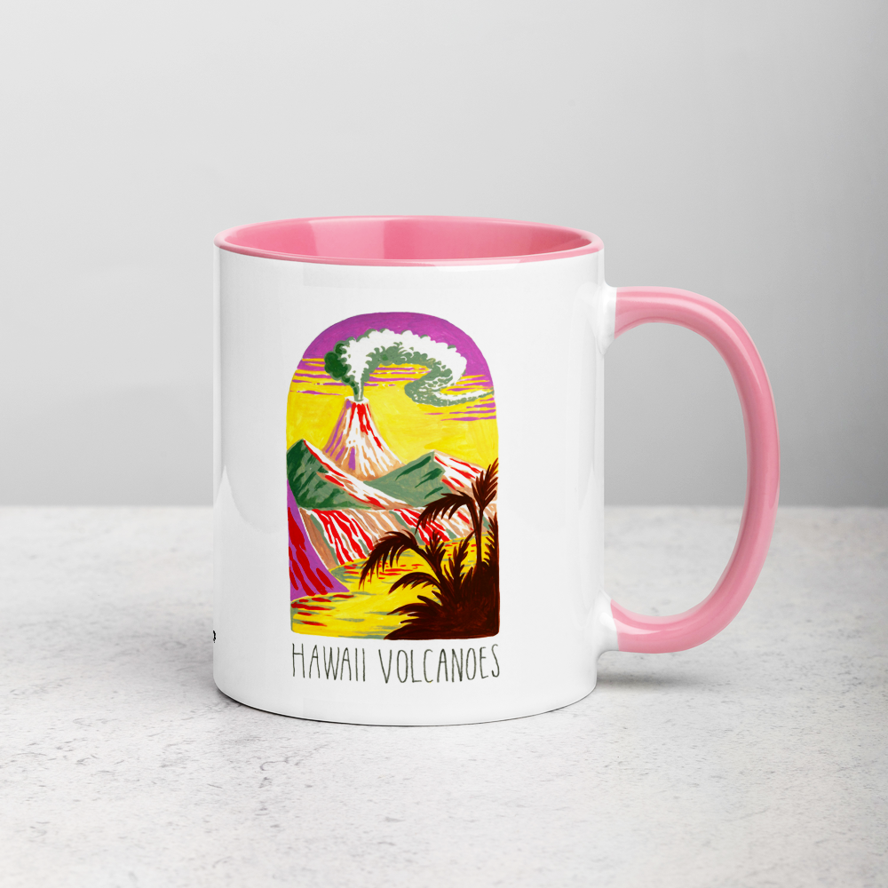 White ceramic coffee mug with pink handle and inside; has Hawaii Volcanoes National Park illustration by Angela Staehling
