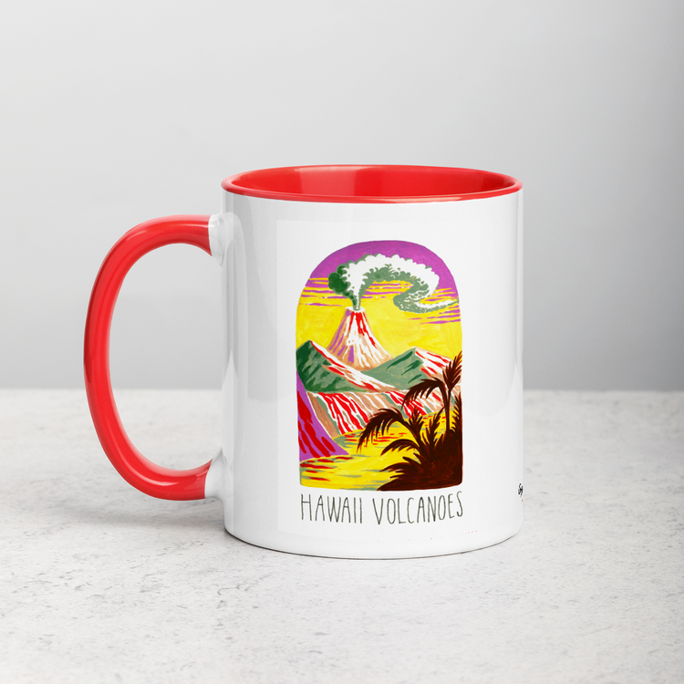 White ceramic coffee mug with red handle and inside; has Hawaii Volcanoes National Park illustration by Angela Staehling