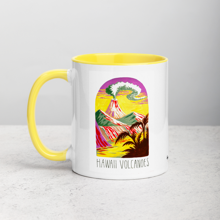 White ceramic coffee mug with yellow handle and inside; has Hawaii Volcanoes National Park illustration by Angela Staehling