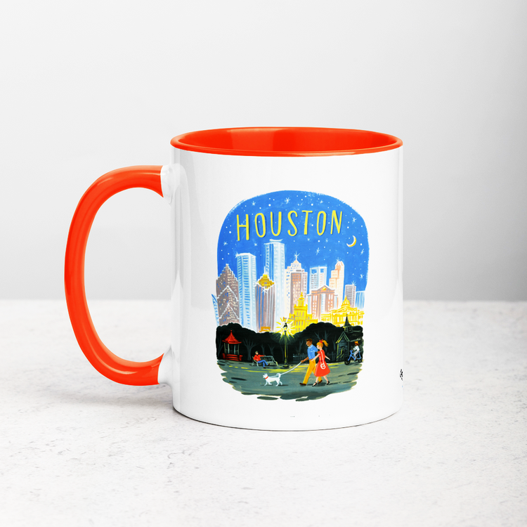 White ceramic coffee mug with orange handle and inside; has Houston Texas illustration by Angela Staehling
