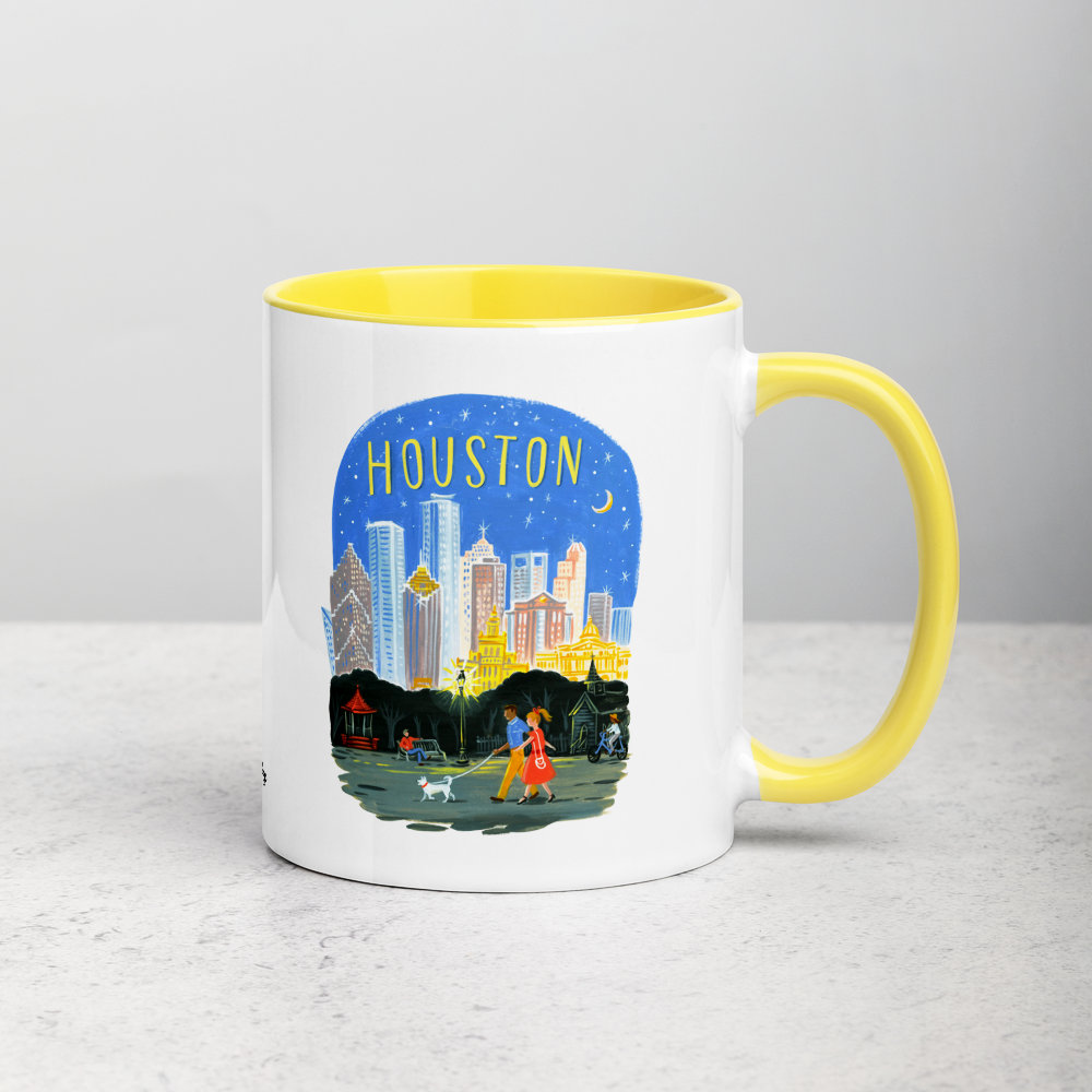 White ceramic coffee mug with yellow handle and inside; has Houston Texas illustration by Angela Staehling