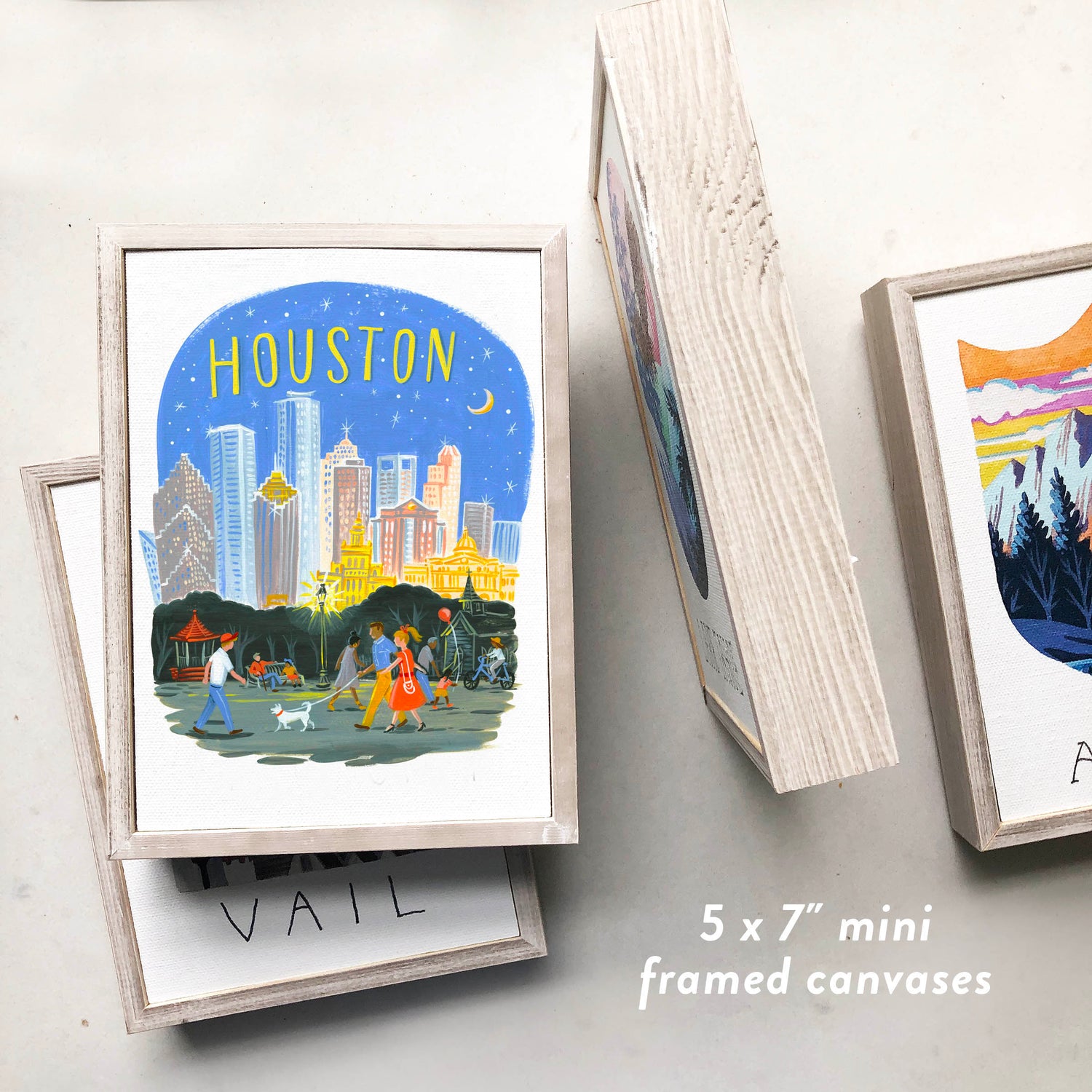 Trendy Downtown Houston Skyline framed art with modern colors and night sky; artwork by Angela Staehling