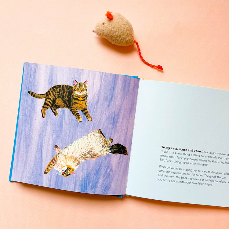 Inse of cat book with two cats laying down