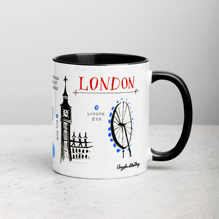 White ceramic coffee mug with black handle and inside; has London landmarks illustration by Angela Staehling