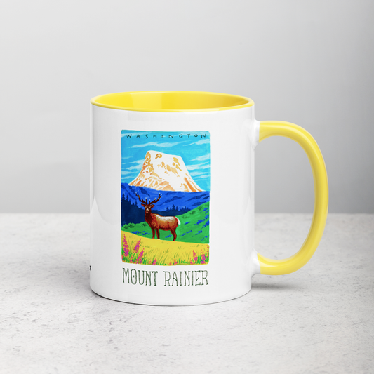 White ceramic coffee mug with yellow handle and inside; has Mount Rainier National Park illustration by Angela Staehling