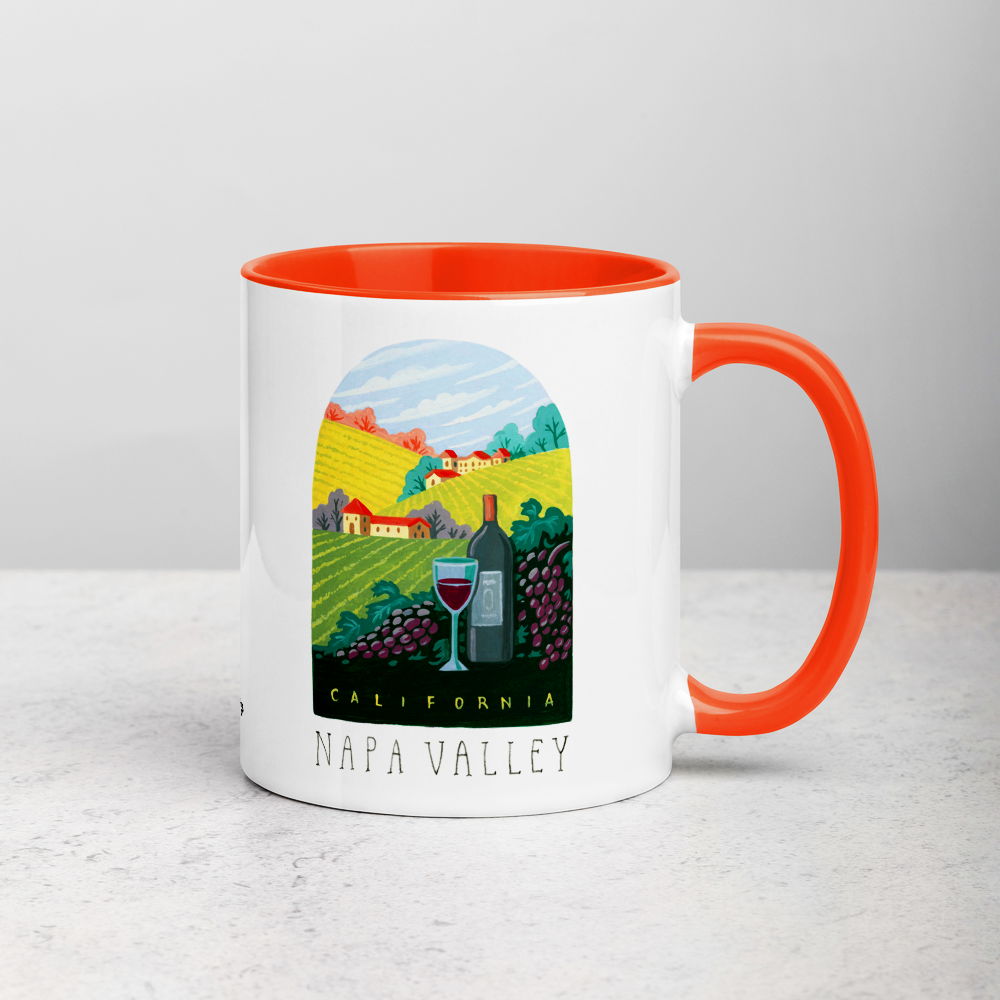 White ceramic coffee mug with orange handle and inside; has Napa Valley California illustration by Angela Staehling