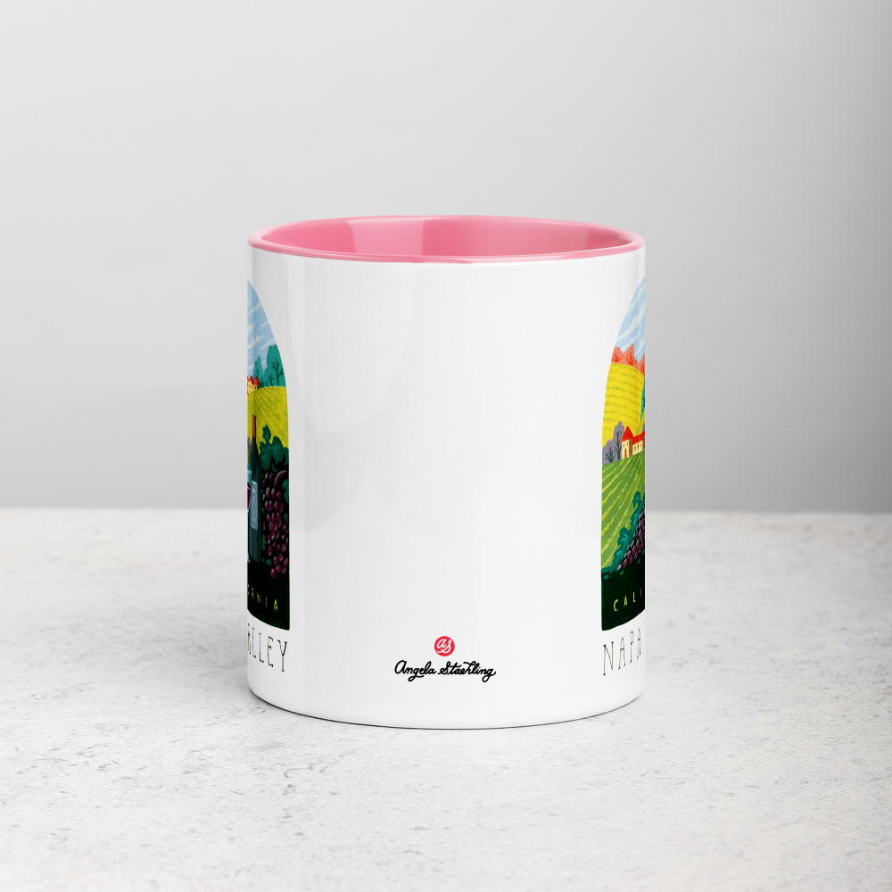 White ceramic coffee mug with pink handle and inside; has Napa Valley California illustration by Angela Staehling