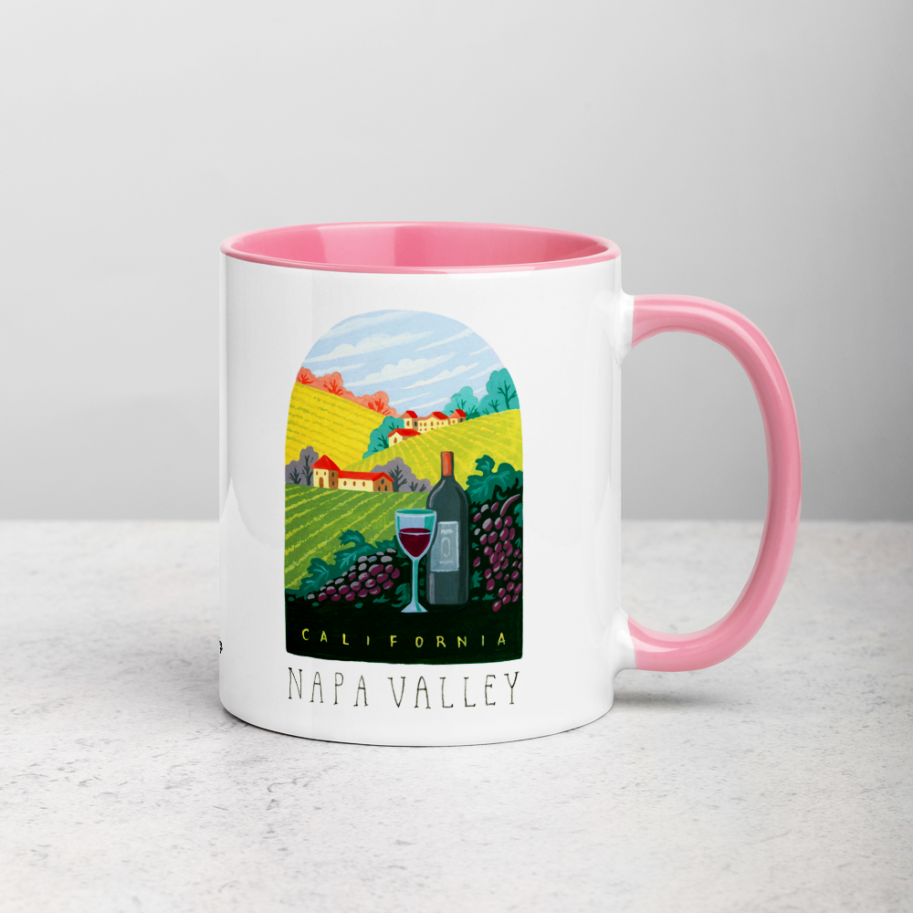 White ceramic coffee mug with pink handle and inside; has Napa Valley California illustration by Angela Staehling