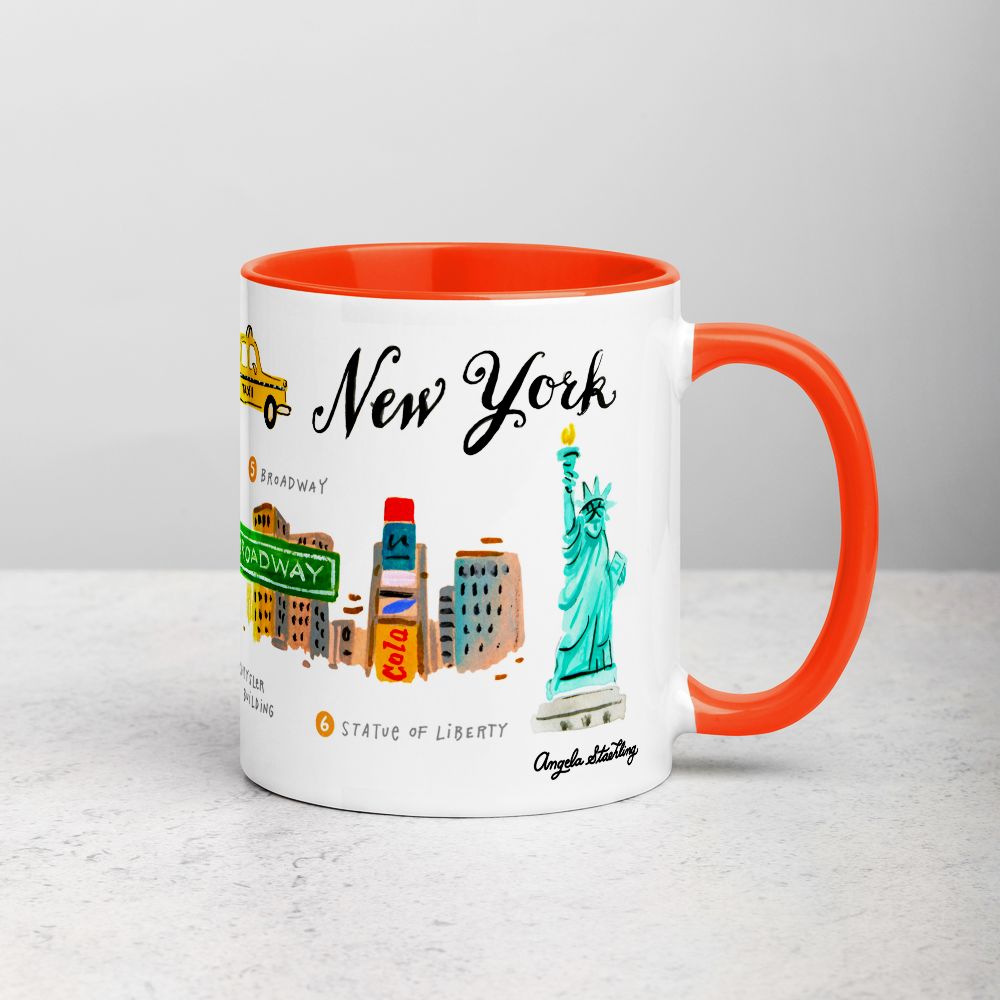 White ceramic coffee mug with orange handle and inside; has New York landmarks illustration by Angela Staehling