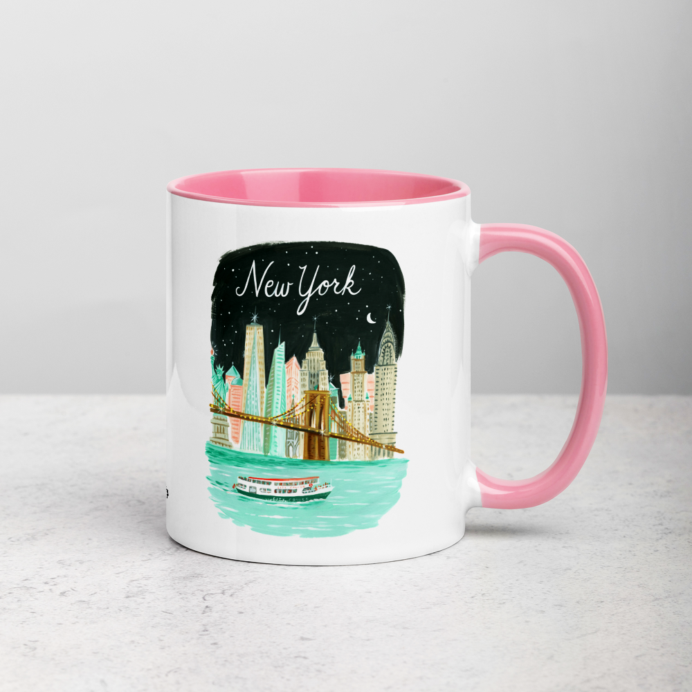 White ceramic coffee mug with pink handle and inside; has New York City Skyline illustration by Angela Staehling