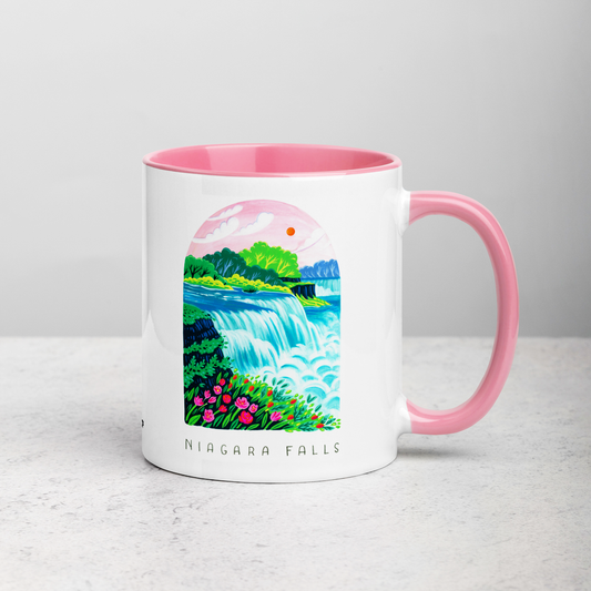 White ceramic coffee mug with pink handle and inside; has Niagara Falls National Park illustration by Angela Staehling