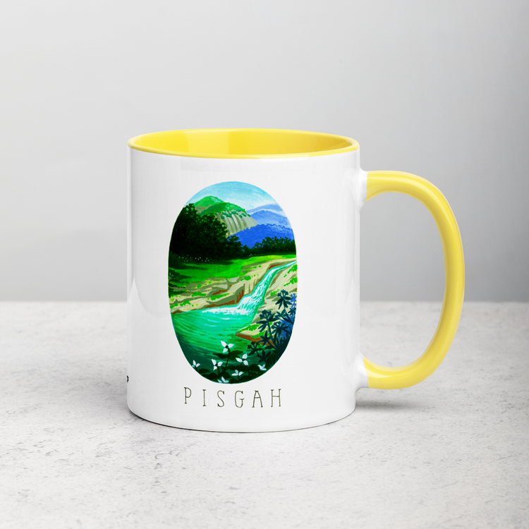 White ceramic coffee mug with yellow handle and inside; has Pisgah National Park illustration by Angela Staehling