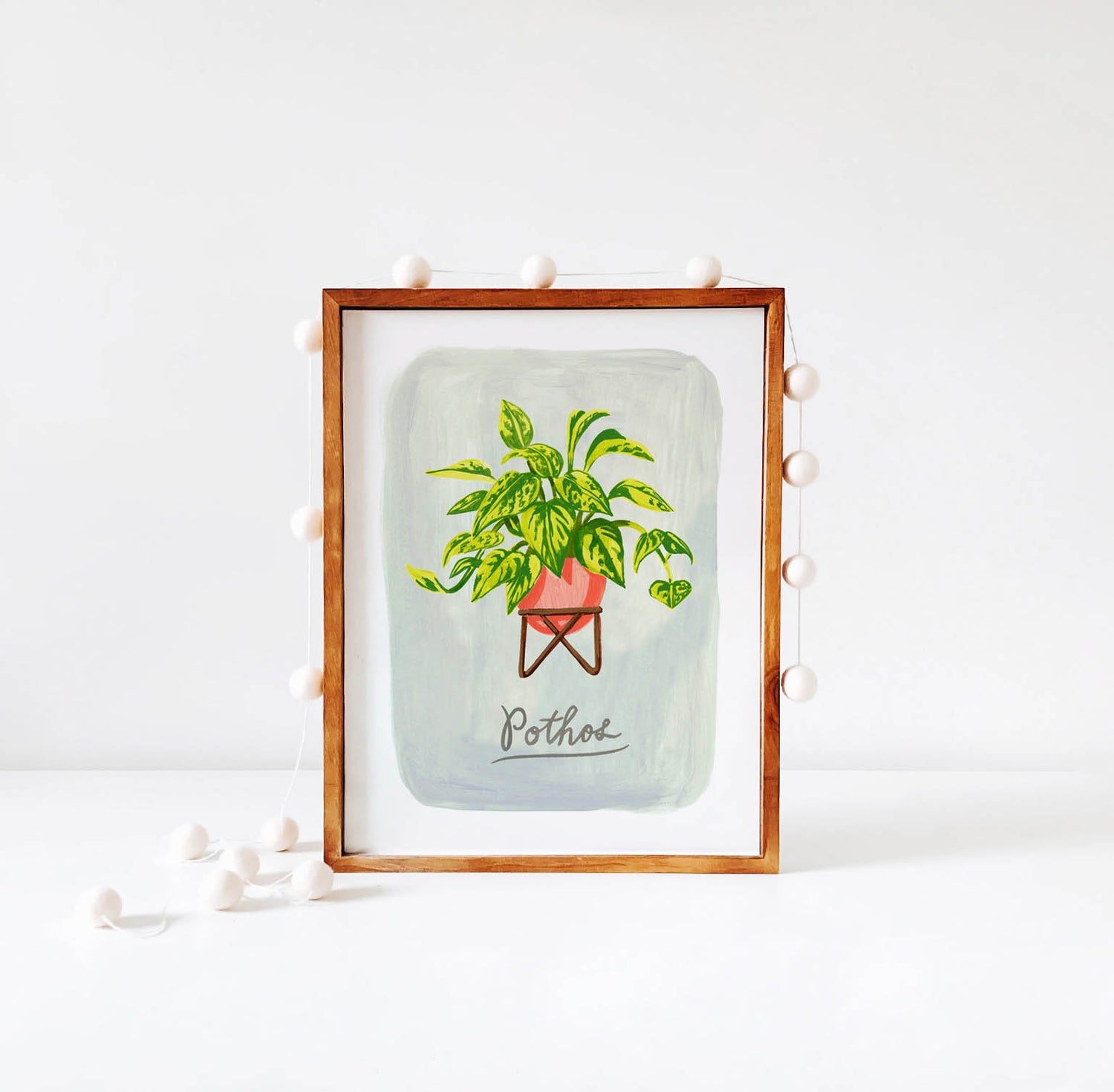 Pothos plant illustration in wood frame