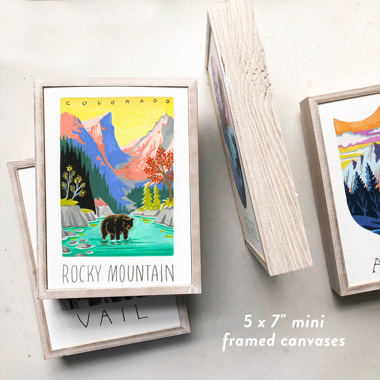 Rocky Mountain National Park framed art with black bear, mountains, and stream; trendy illustration by Angela Staehling