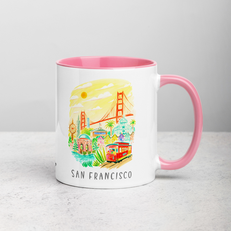 White ceramic coffee mug with pink handle and inside; has San Francisco Golden Gate illustration by Angela Staehling