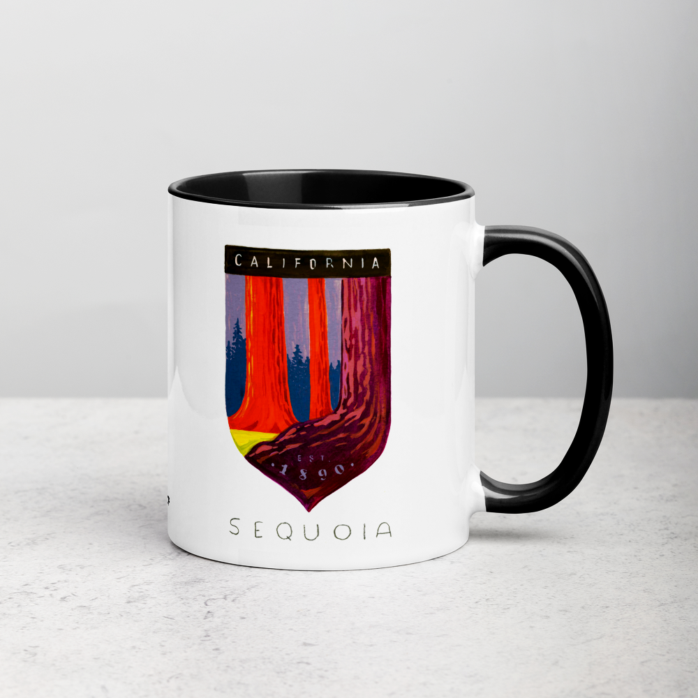 White ceramic coffee mug with black handle and inside; has Sequoia National Park illustration by Angela Staehling